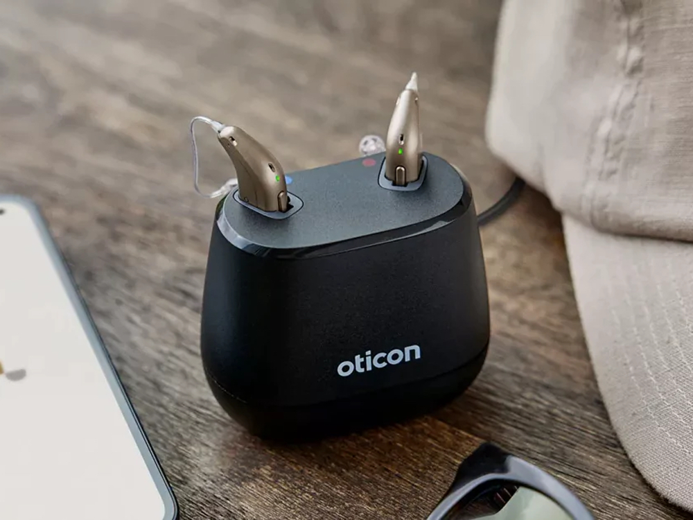 Rechargeable hearing aids charging overnight, an alternative to disposable batteries at Advanced Hearing Technology in Naples, FL