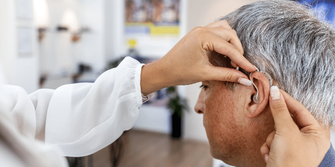 Bonita Springs FL man getting fitted for hearing aids