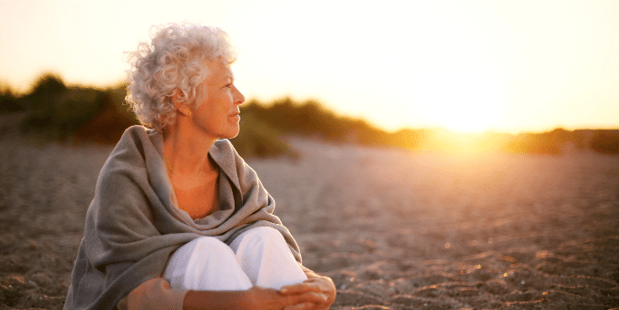 mature woman watching sunset after cognivue treatment